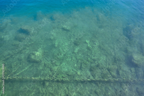 Fototapeta Naklejka Na Ścianę i Meble -  Seabed next to the dock, photo above the surface of the water