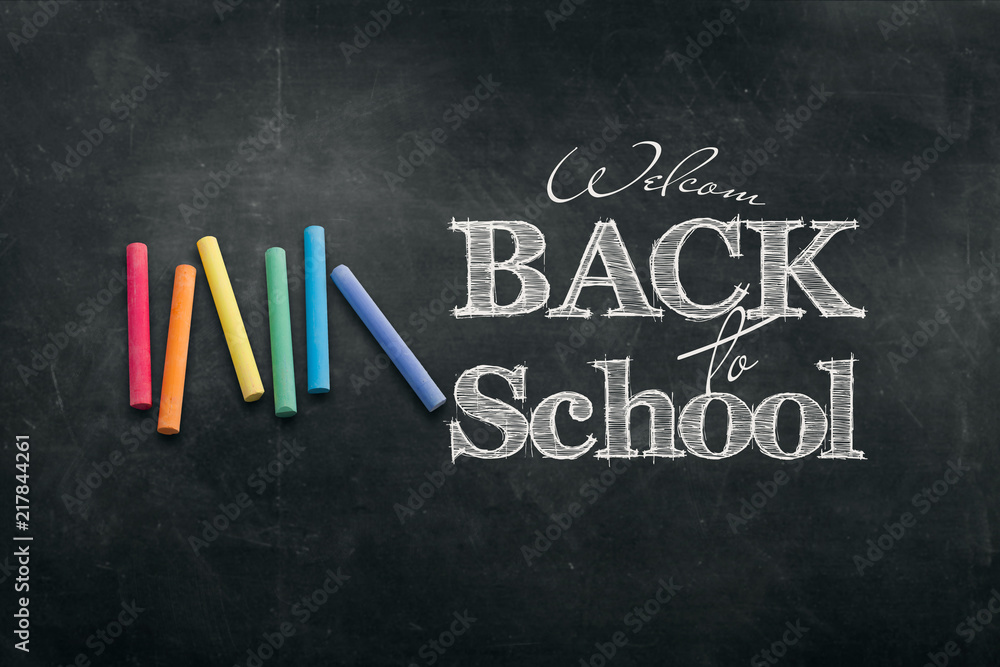 Fototapeta premium Inscription Back to school, chalk scribble background on blackboard. The concept of the day of knowledge, September 1, the beginning of classes.