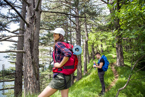 Young couple on their hiking trip.Hikers exploring nature
