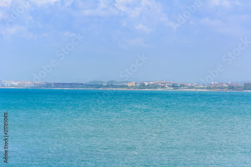 picturesque view from the sea to the far shore with beaches and hotels © pal1983