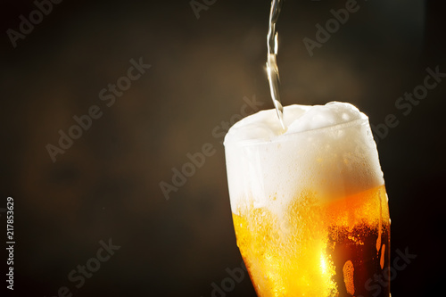 Wallpaper Mural A glass of beer on a dark background. Torontodigital.ca