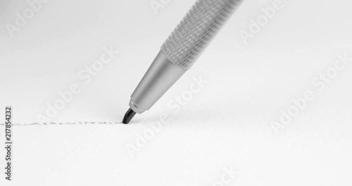 Artists hands drawing pencil writes line on paper