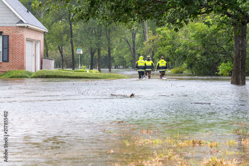 The first responders inspect flooded houses in flooded residential area. Hurricane Harvey caused many flooded areas in Houston and its suburbs