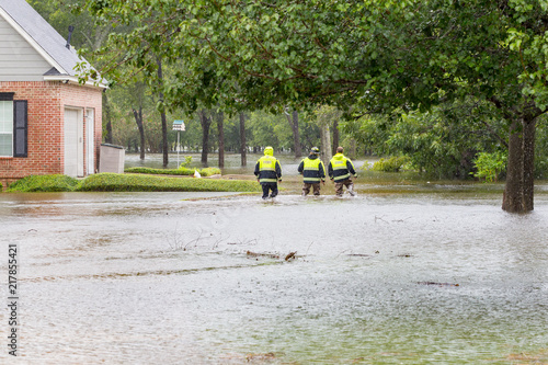 The first responders inspect flooded houses in flooded residential area. Hurricane Harvey caused many flooded areas in Houston and its suburbs