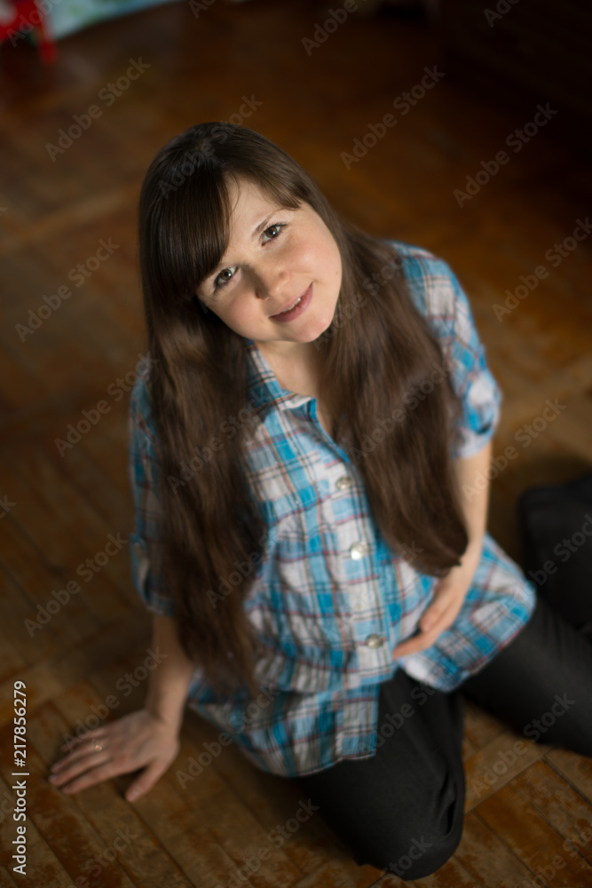 Fototapeta premium Portrait of a young beautiful pregnant girl