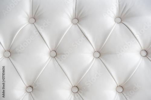 white texture background of leather sofa with buttons