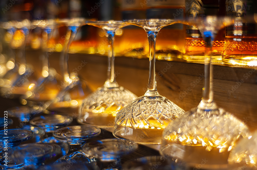 glass row bar counter . Many empty wineglasses glass row bar counter . Many empty wineglasses