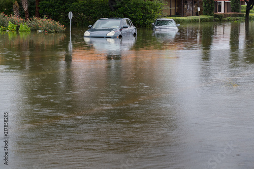 Cars submerged in Houston, Texas, US during hurricane Harvey. Water could enter the engine, transmission parts or other places. Disaster Motor Vehicle Insurance Claim Themed. Severe weather concept