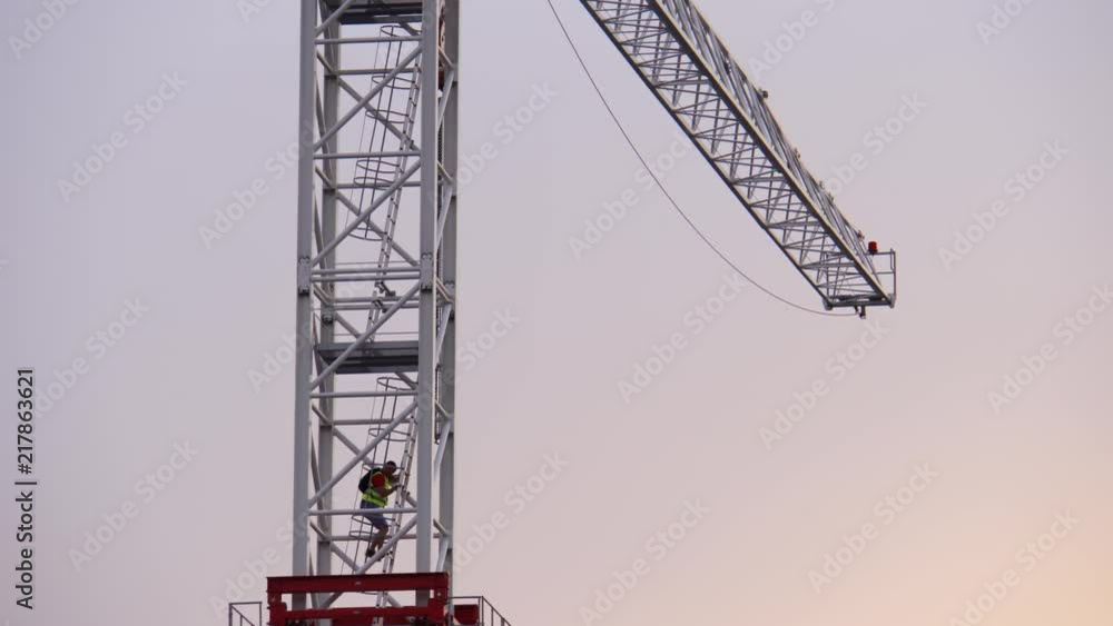 Construction worker coming down from a tower crane at golden hour, at the end of the day
(editorial) Construction worker coming down from a tower crane at golden hour, at the end of the day
(editorial)
