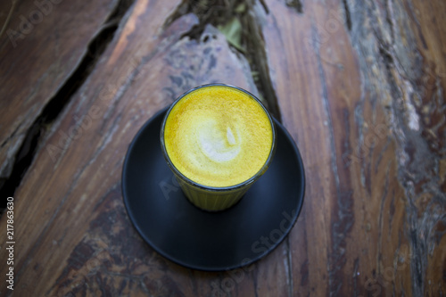 Golden milk with turmeric powder photo