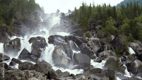 A large cascading mountain waterfall. photo