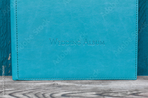 photobook with leather cover.
Photo book on a bright background.
wedding album
Photo album on a wooden surface.
 photo