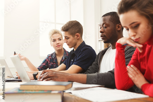 Multiethnic classmates preparing for exams together © Prostock-studio