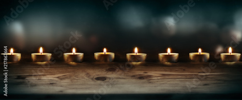 Burning candles with dark blue background