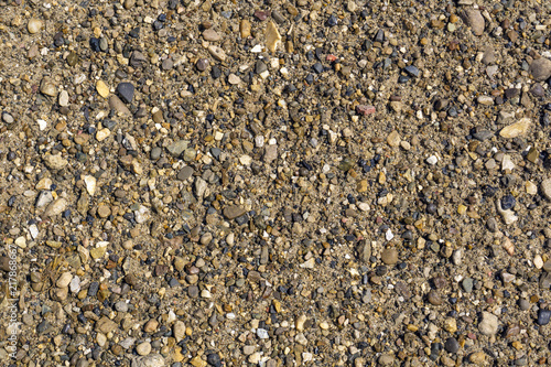 background, texture - small pebbles and sand on the river bank