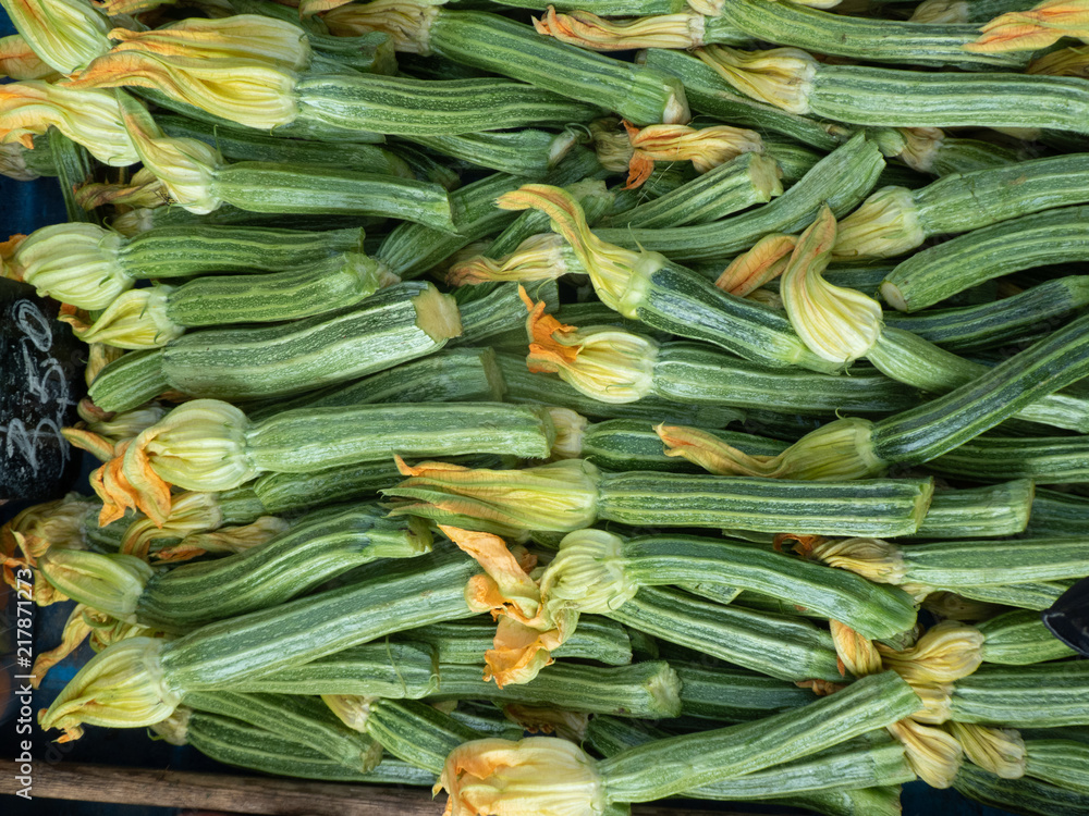 Vegetables at farmers' market: fresh courgette flowers