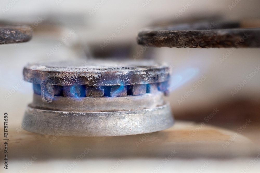 Close-up of dirty gas stove burning fire Close-up of dirty gas stove burning fire