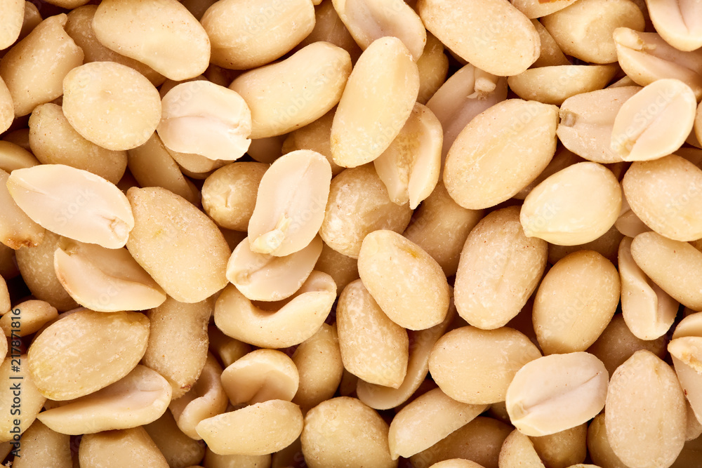 Peeled peanuts on a white background. Healthy food. Nuts. Peeled peanuts on a white background. Healthy food. Nuts.