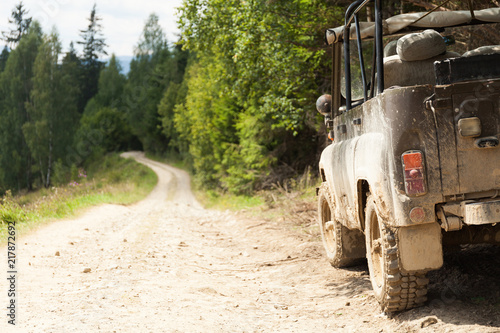 Jeep car 4х4 adventure travel. Old mountain dust road. Safari adventure. Copy space for text.