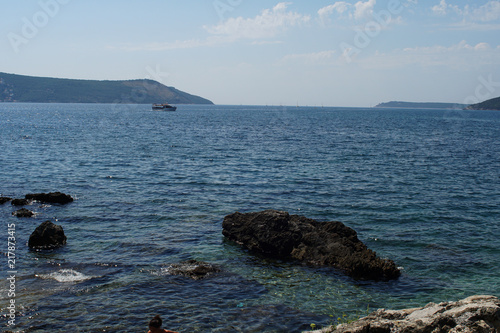 Rocky bay with giant boulders and wild herbs