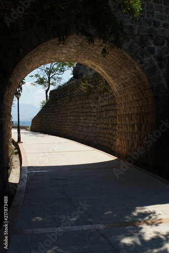 Old tunnel on a promenade walk constructed with cobblestone