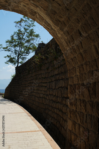 Old tunnel on a promenade walk constructed with cobblestone