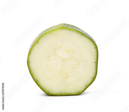 Slice of zucchini isolated on white background. Macro shot.
