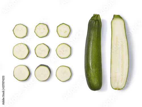 Zucchini collection. Whole half and sliced zucchini isolated on white background. Top view.