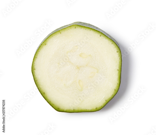 Slice of zucchini isolated on white background. Close up.