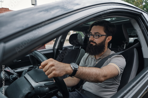 Modern casual bearded man driving a car © arthurhidden