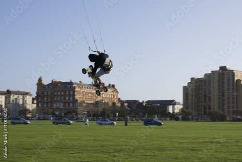 I started taking pictures of this random guy Kite Boarding when he start to come closer.  After a while he started to perform stunts right in front of me as if he were enjoying the attention