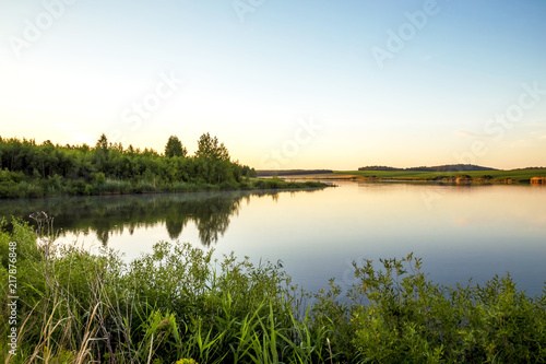 Summer sunny landscape. Morning, dawn on the lake. Saratov Region, Russia.