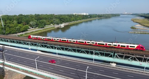 Aerial Follow View Of Train Going On A Bridge