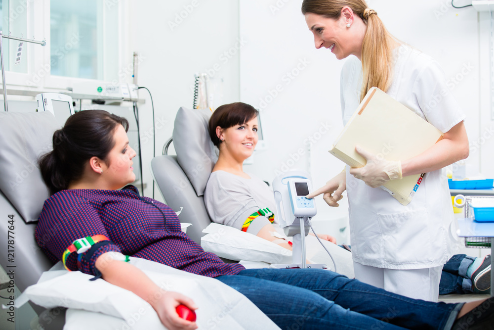 Obraz premium Doctors assistant collecting donation blood