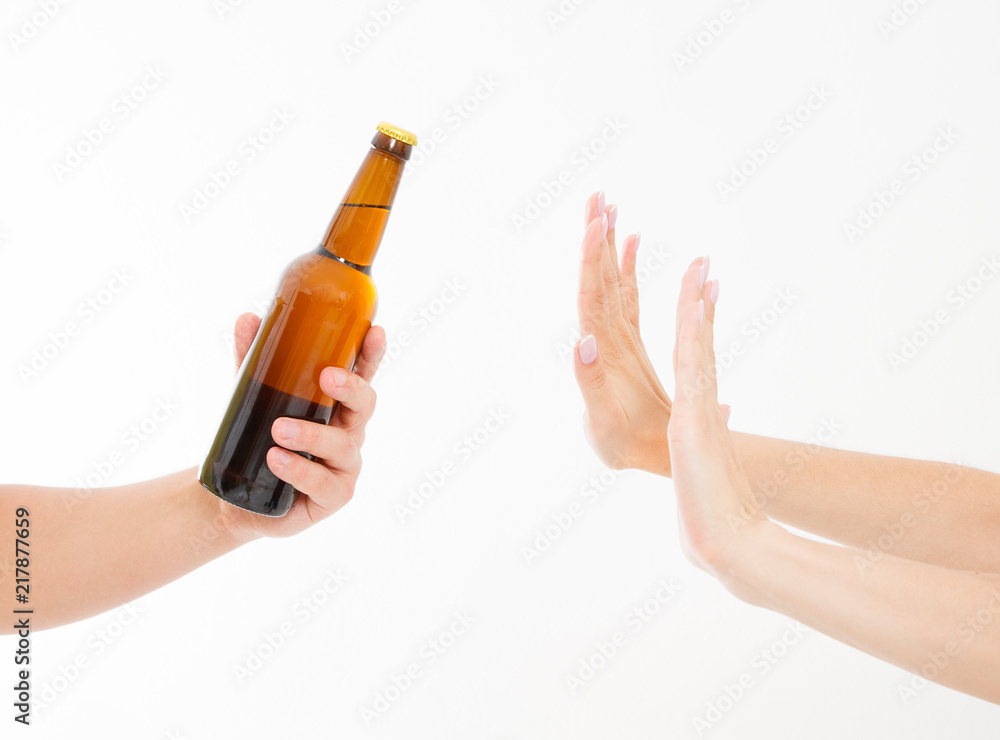 female hand reject a bottle of beer isolated on white background.anti alcohol concept. Copy space female hand reject a bottle of beer isolated on white background.anti alcohol concept. Copy space