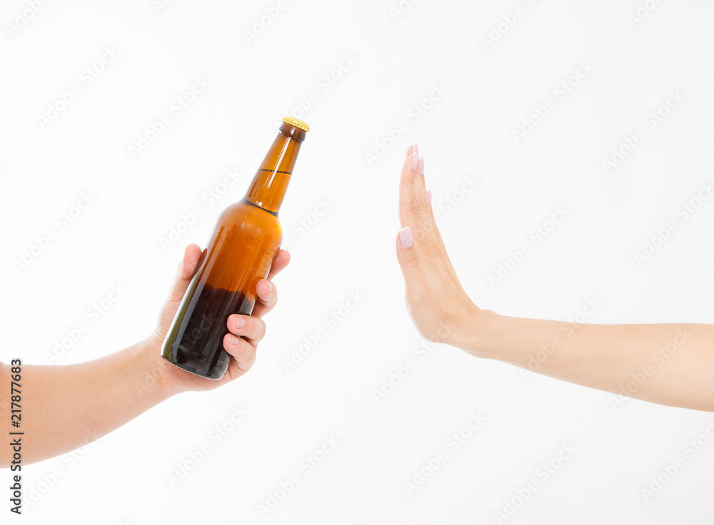 female hand reject a bottle of beer isolated on white background.anti alcohol concept. Copy space female hand reject a bottle of beer isolated on white background.anti alcohol concept. Copy space