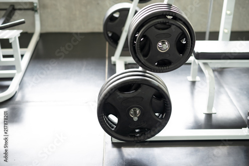 Black dumbbell set in gym. fitness and healthy lifestyle concept.