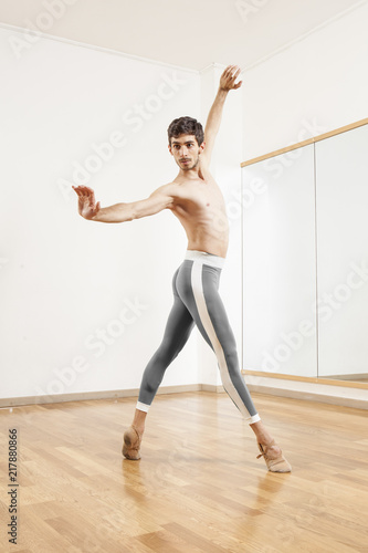 Young beautiful male  ballett dancer posing in studio © Tommaso Lizzul