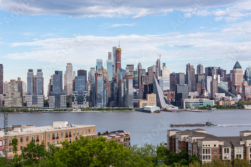 New York City midtown Manhattan skyline panorama view from Boulevard East Old Glory Park over Hudson River.