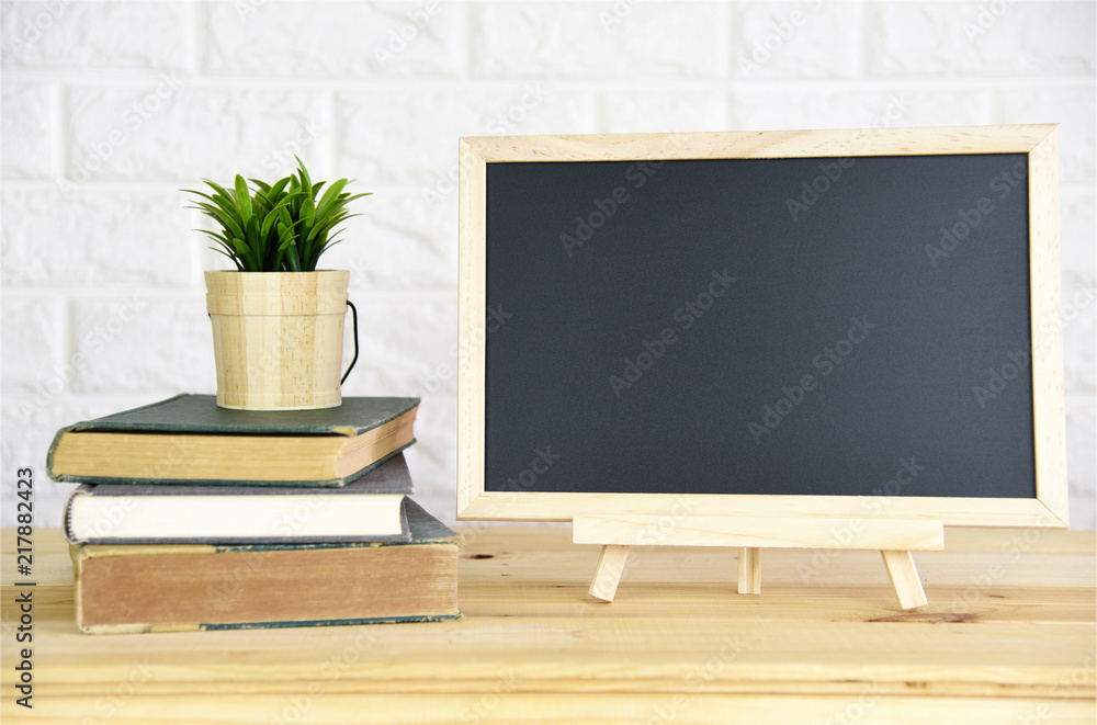 Blackboard on the desk at home office Blackboard on the desk at home office
