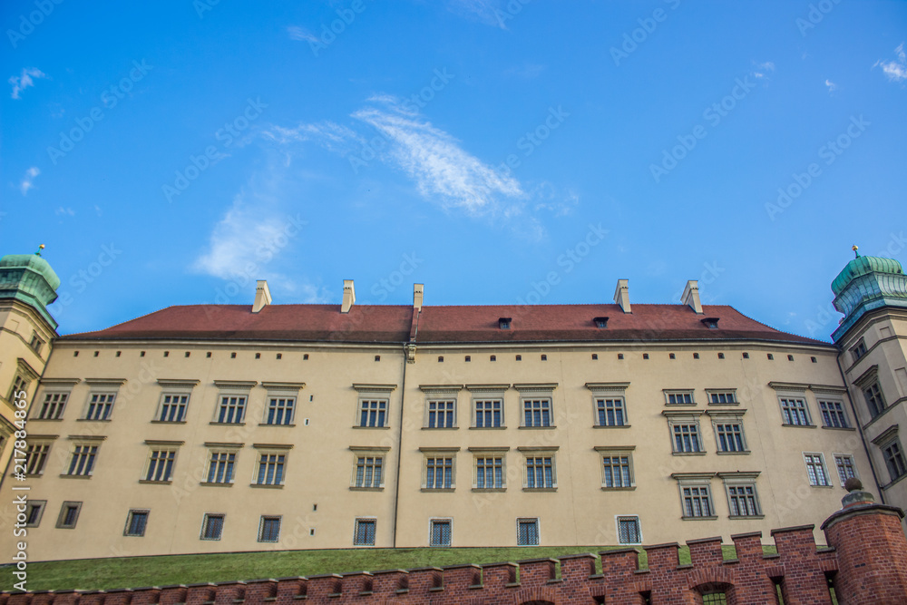 symmetry old colorful building facade concept on blue sky background
