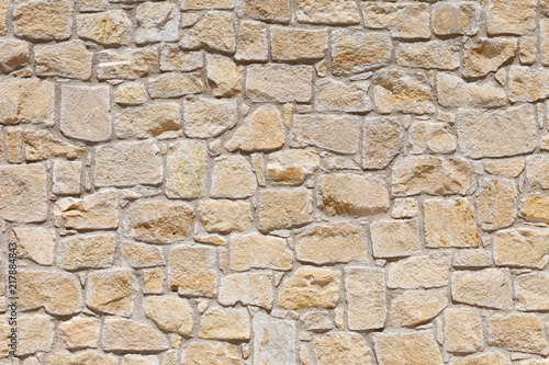 Wall of light  yellow Sandstone. Background image  texture.