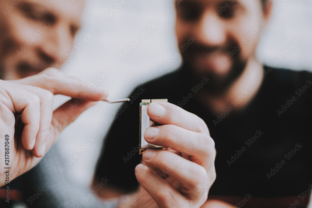 Two Men Repairing Hardware Equipment from PC.