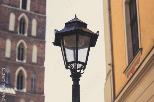 Wallpaper Mural old city street concept wit metal lantern on foreground between unfocused buildings on background Torontodigital.ca