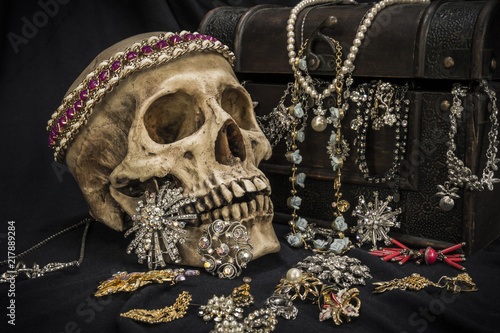 Still life with a human skull with old treasure chest and gold, diamond