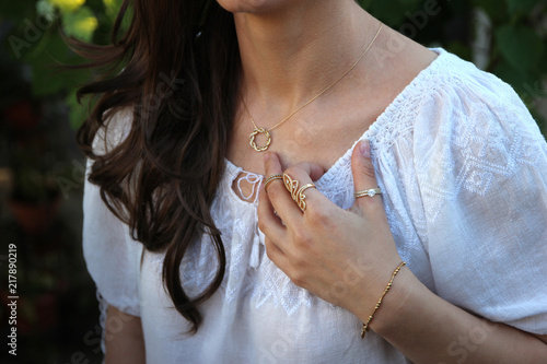 Close up of beautiful woman wearing shiny jewelry