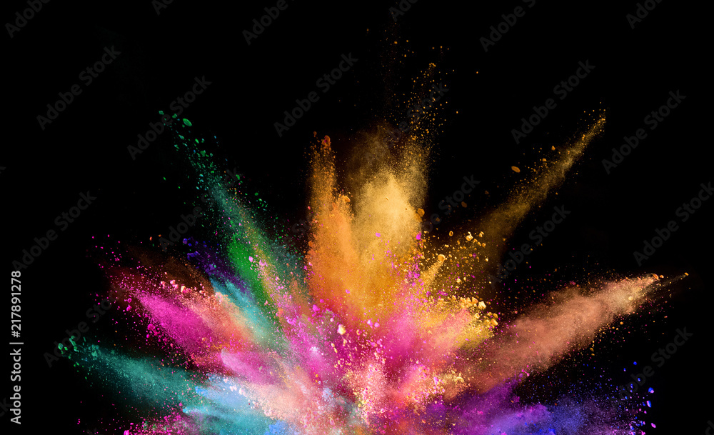 Coloured powder explosion isolated on black background