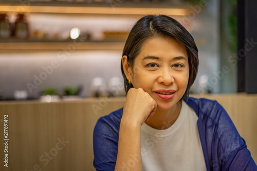 Portrait of short hair Asian woman with smiling.