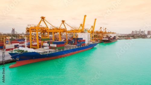 Ship container from sea port and cityscape background for import export or transportation concept.