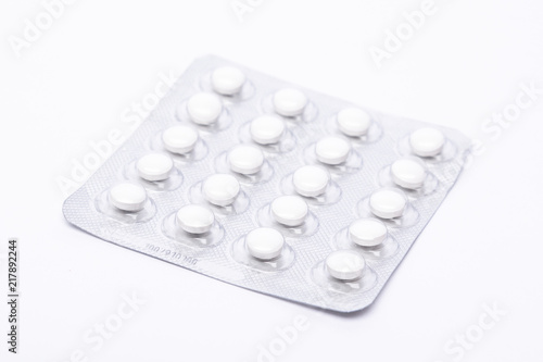 Medicine pills in silver tinfoil lining